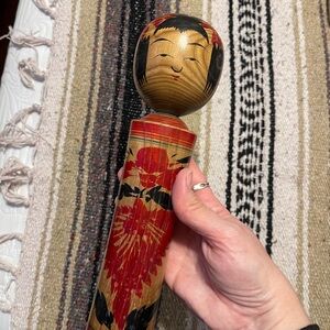 Handcrafted Wooden Doll from Japan with Red and Black Design